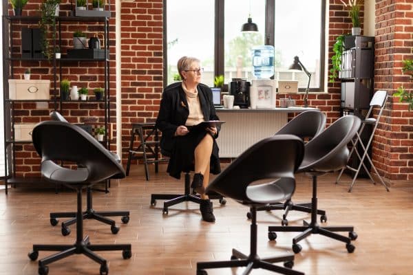 Mental specialist looking around and waiting on aa meeting to start